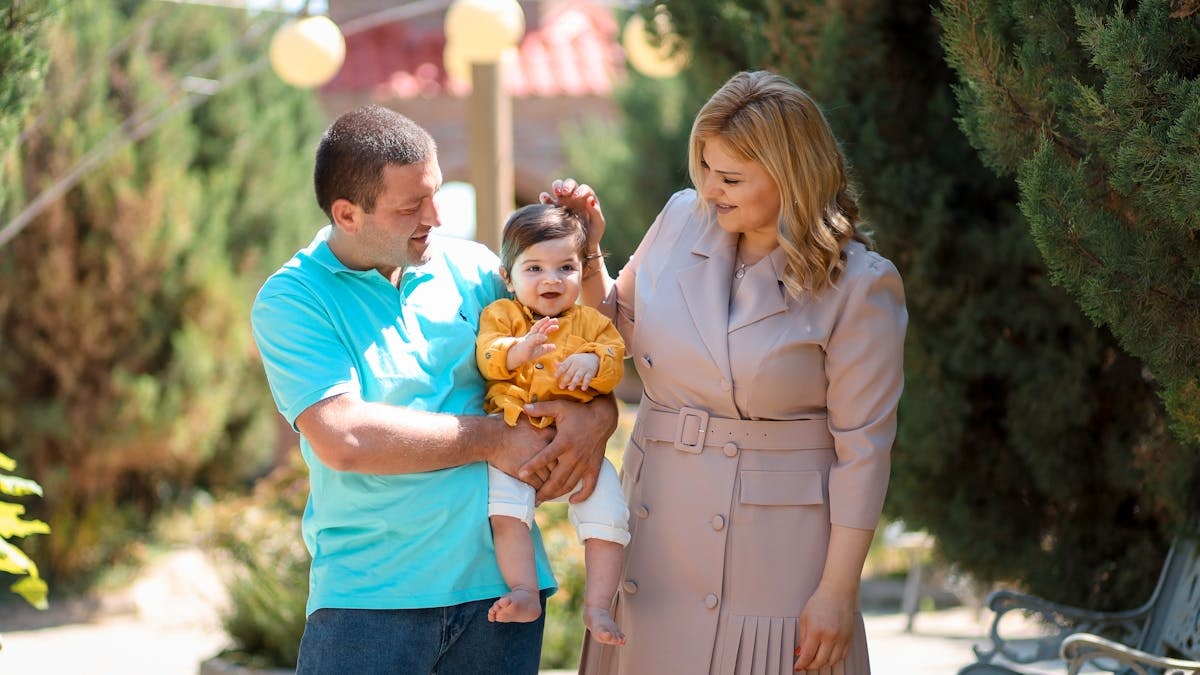 Family enjoying a sunny day outdoors, showcasing love and connection.